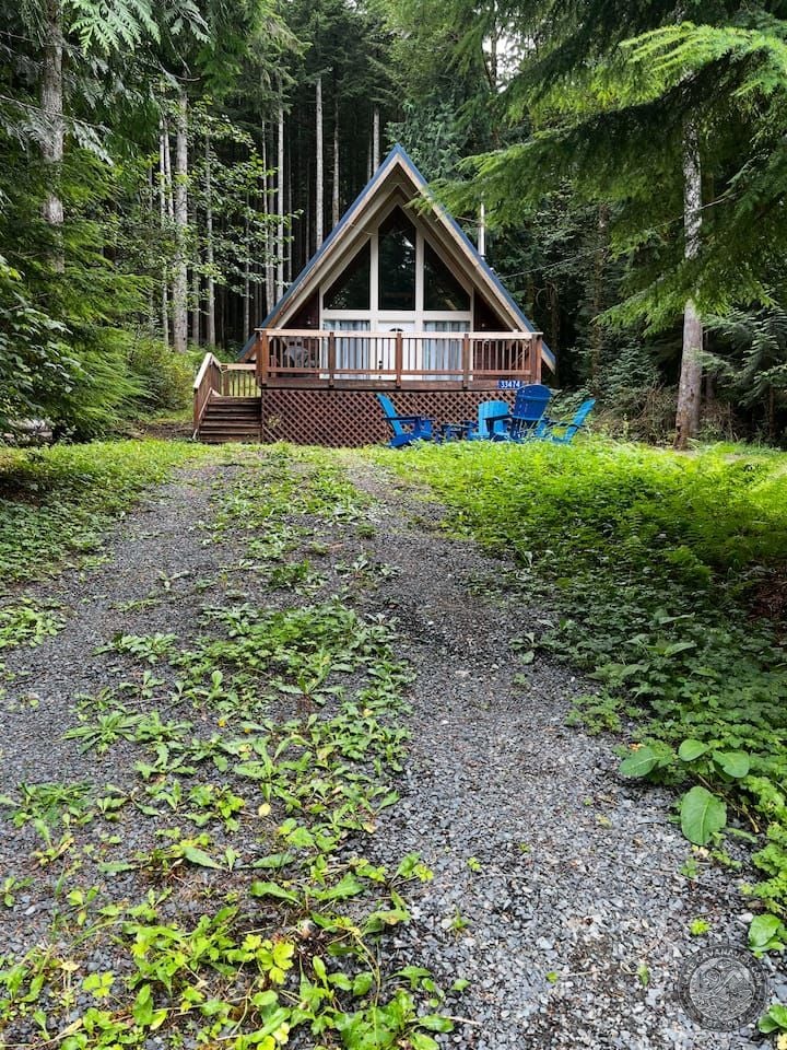 Rustic A-Frame Cabin With Front Deck Among Evergreens Near Lake Cavanaugh